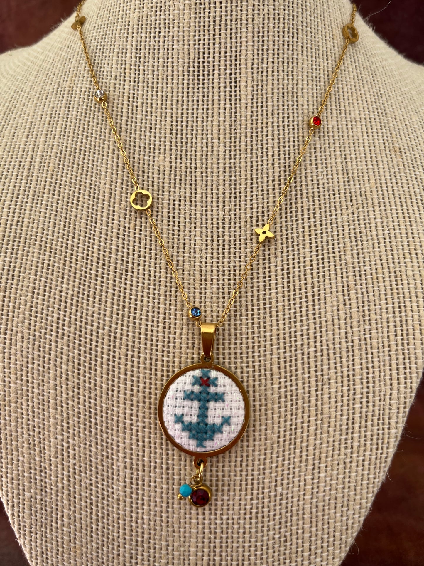 Hand embroidered cross stitch pendant and chain - anchor blue