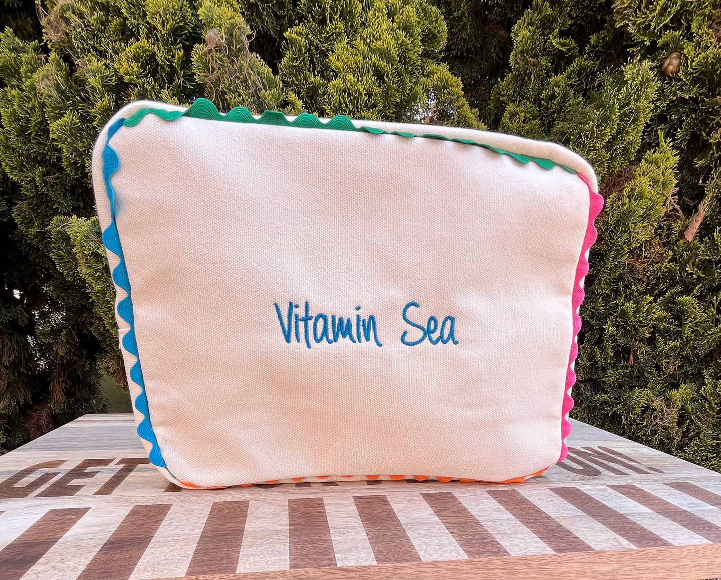 Embroidered canvas cosmetic bag with ric-rac border