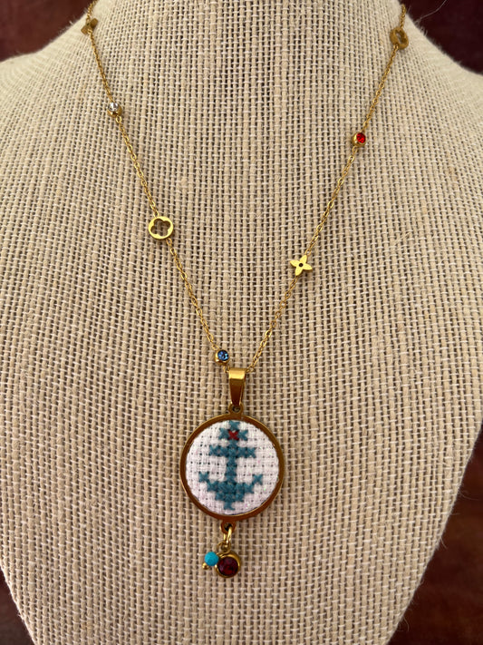 Hand embroidered cross stitch pendant and chain - anchor blue