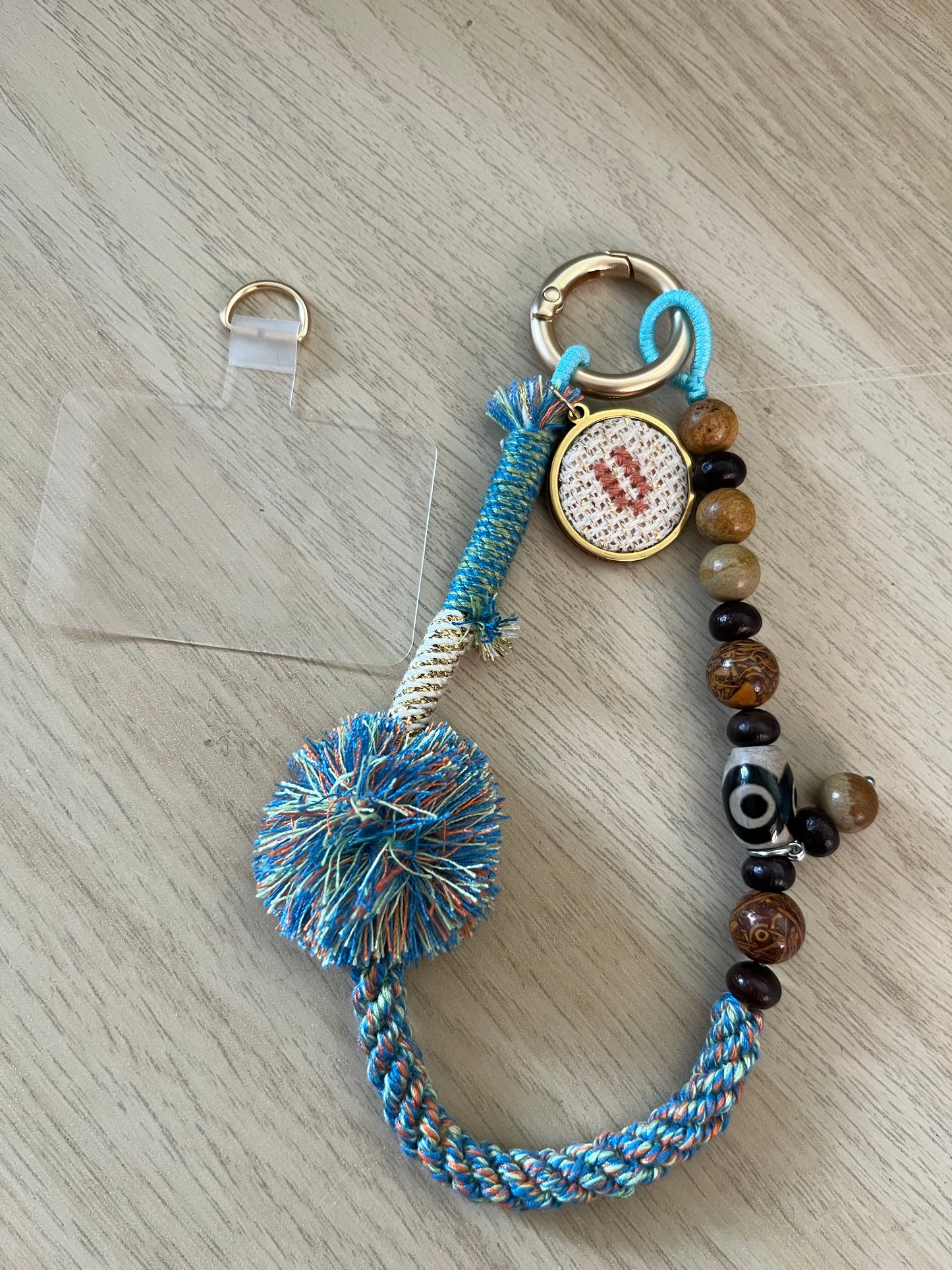 Beaded bag and phone charm with hand embroidered personalisation.
