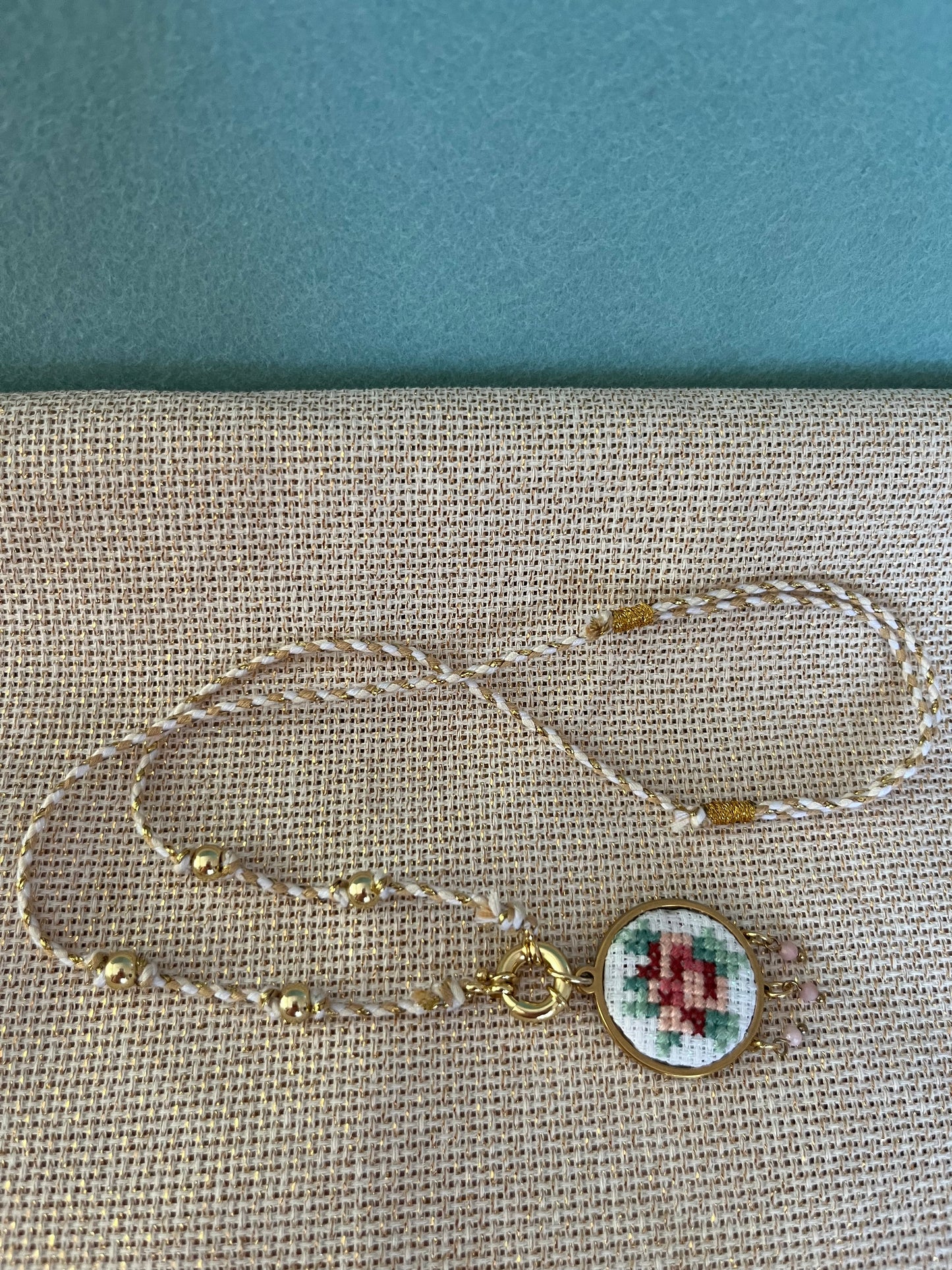 Hand embroidered cross stitch pendant and knotted necklace - rose