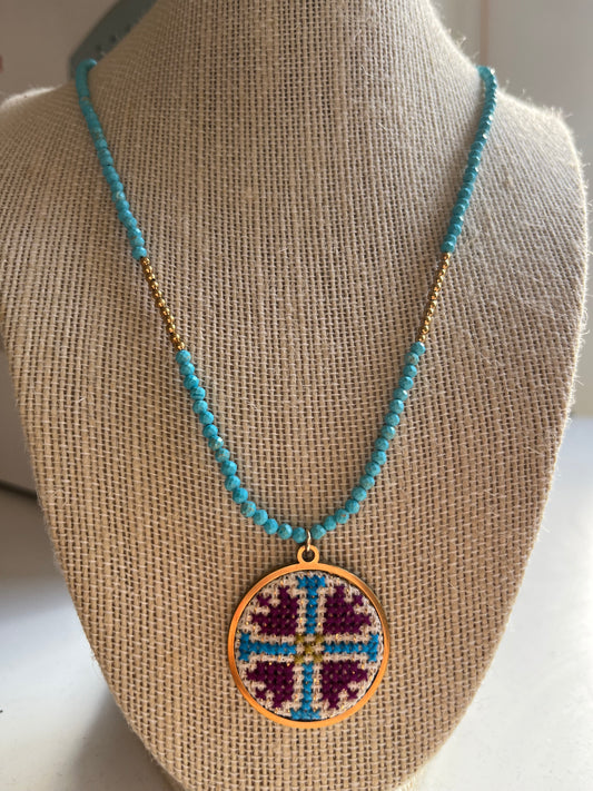 Hand embroidered cross stitch pendant and turquoise necklace