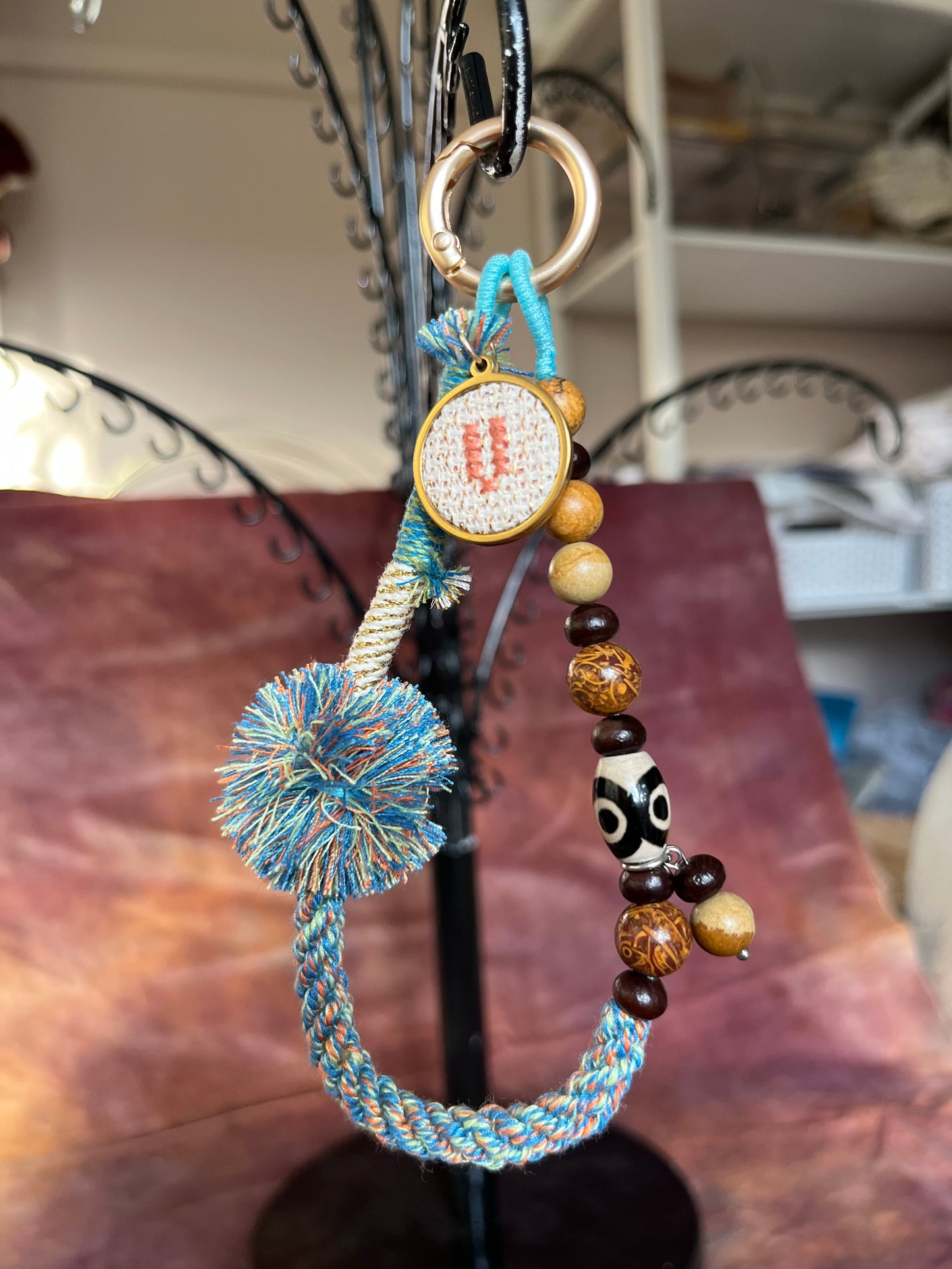 Beaded bag and phone charm with hand embroidered personalisation.