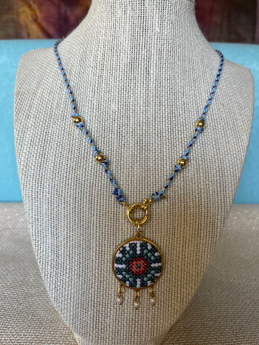 Hand embroidered cross stitch pendant and knotted necklace - geometric flower