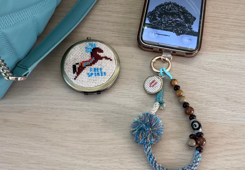 Beaded bag and phone charm with hand embroidered personalisation.