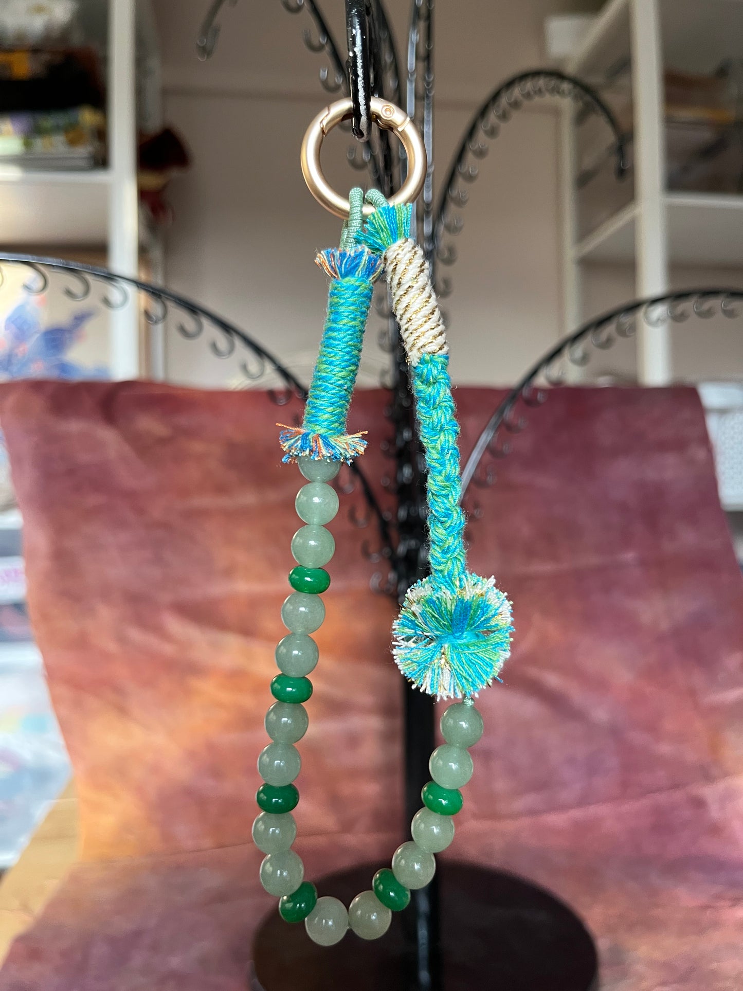 Beaded bag and phone charm with hand embroidered personalisation.