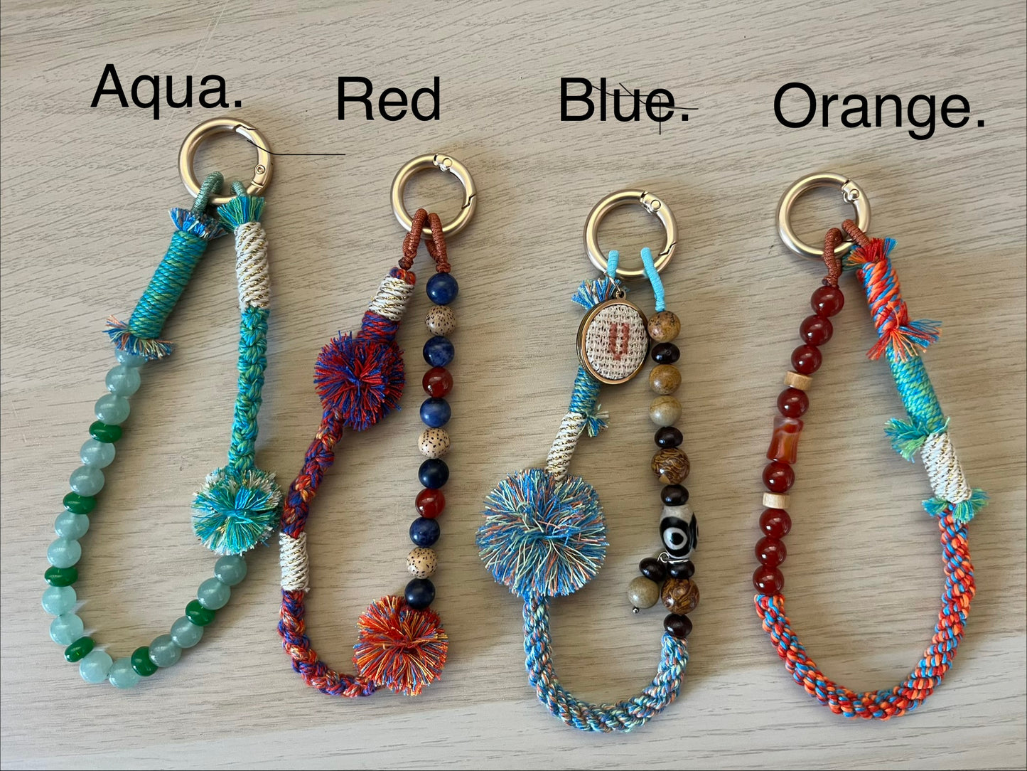 Beaded bag and phone charm with hand embroidered personalisation.