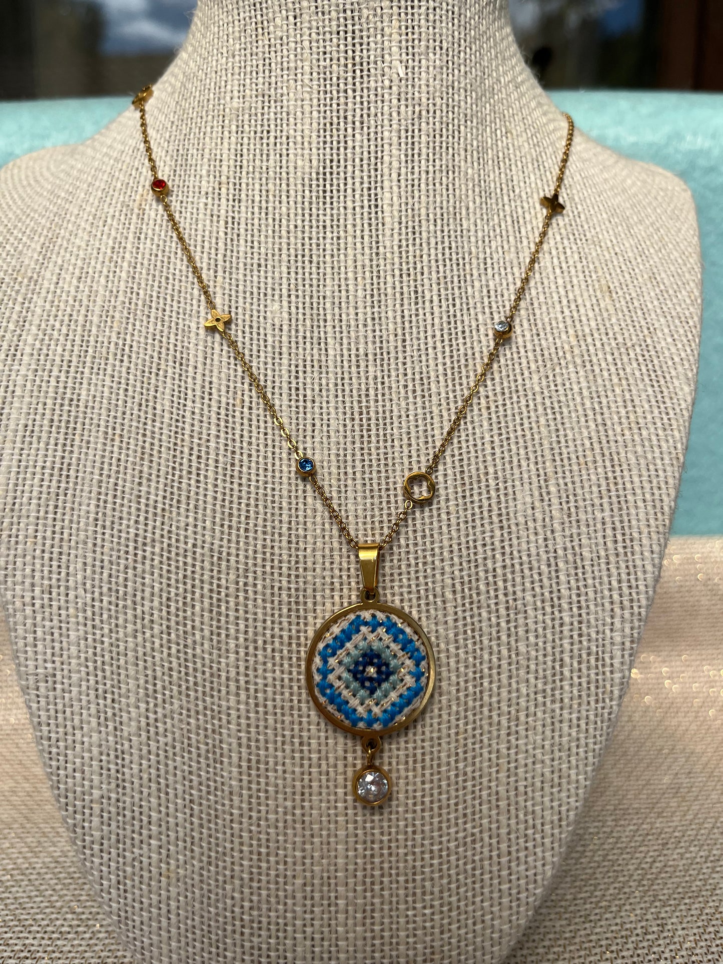 Hand embroidered cross stitch pendant and chain - Mati.