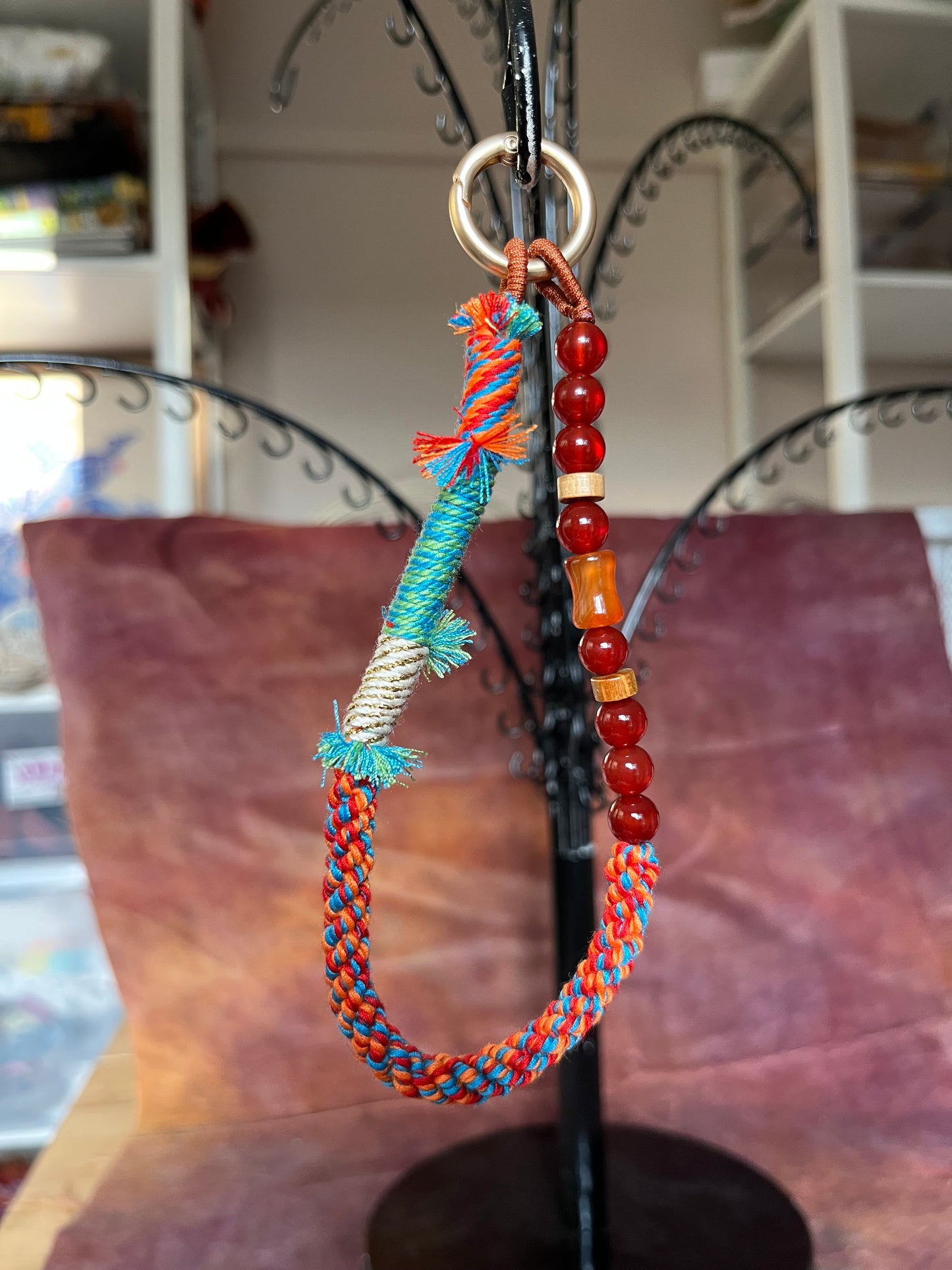 Beaded bag and phone charm with hand embroidered personalisation.